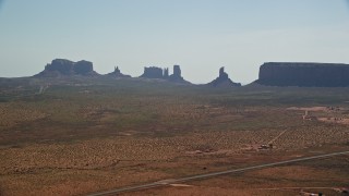 5.5K aerial stock footage of flying by desert buttes and mesas in Monument Valley, Utah, Arizona Aerial Stock Footage | AX135_004