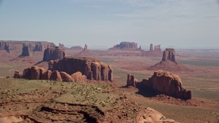 AX135_022E - 5.5K aerial stock footage wide view of buttes, seen from Spearhead Mesa in Monument Valley, Utah, Arizona