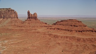 5.5K aerial stock footage of approaching Setting Hen Butte in Monument Valley, Utah, Arizona Aerial Stock Footage | AX135_050