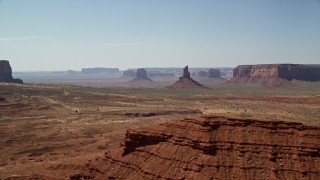 5.5K aerial stock footage of a view of Big Indian Butte and Sentinel Mesa, Monument Valley, Utah, Arizona Aerial Stock Footage | AX135_062