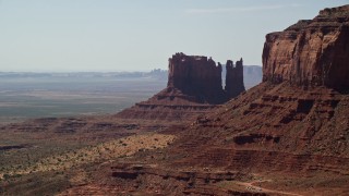 5.5K aerial stock footage of passing by desert buttes in Monument Valley, Utah, Arizona Aerial Stock Footage | AX135_063E