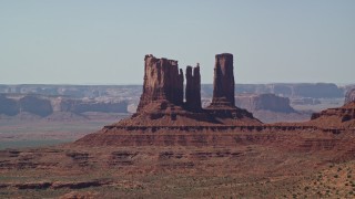 5.5K aerial stock footage of a group of desert buttes in Monument Valley, Utah, Arizona Aerial Stock Footage | AX135_065