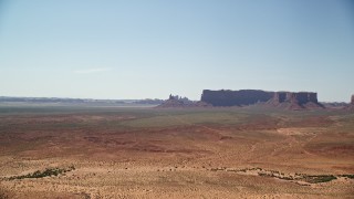 5.5K aerial stock footage of approaching Rooster Rock and Meridian Butte, Monument Valley, Utah, Arizona Aerial Stock Footage | AX135_120