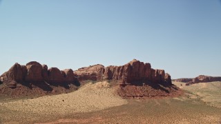 5.5K aerial stock footage of approaching a rugged desert butte, Monument Valley, Utah, Arizona Aerial Stock Footage | AX135_131E