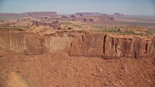 5.5K aerial stock footage of flying over the top of Meridian Butte in Monument Valley, Utah, Arizona Aerial Stock Footage | AX135_168E