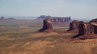 5.5K aerial stock footage of passing by Gray Whiskers Butte, Monument Valley, Arizona, Utah Aerial Stock Footage | AX135_190E