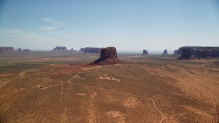 5.5K aerial stock footage of a wide view of open desert, mesas and buttes, Monument Valley, Arizona, Utah Aerial Stock Footage | AX135_194