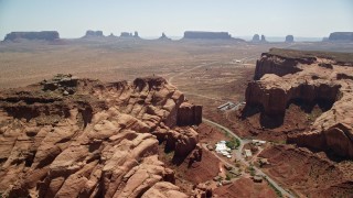 AX135_202E - 5.5K aerial stock footage of flying by Oljeto Mesa, revealing the Monument Valley Airport, Utah