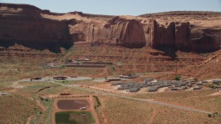 5.5K aerial stock footage of flying by Goulding's Lodge at the base of Rock Door Mesa, Goulding, Utah Aerial Stock Footage | AX135_205