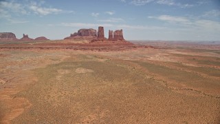 5.5K aerial stock footage of flying toward jagged desert buttes, Monument Valley, Utah, Arizona Aerial Stock Footage | AX136_034E