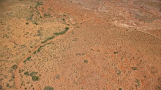 AX136_036E - 5.5K aerial stock footage of approaching towering desert buttes in Monument Valley, Utah, Arizona