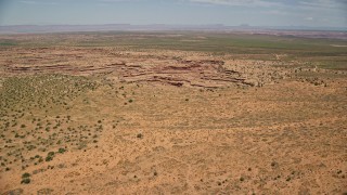 5.5K aerial stock footage of flying by desert rock formations in Navajo Nation Reservation, Utah, Arizona Aerial Stock Footage | AX136_052E