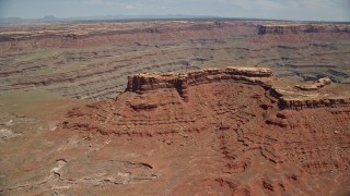 5.5K aerial stock footage of flying over butte near deep desert canyons in Navajo Nation Reservation, Utah, Arizona Aerial Stock Footage | AX136_056E