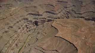 5.5K aerial stock footage of passing by San Juan River in a deep desert canyon, Navajo Nation Reservation, Utah, Arizona Aerial Stock Footage | AX136_058E