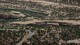 5.5K aerial stock footage of orbiting around Owachomo Bridge, Natural Bridges National Monument, Utah Aerial Stock Footage | AX136_118E