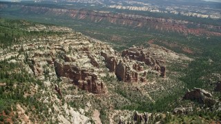 5.5K aerial stock footage of orbiting rock formations in a forested canyon, Manti-La Sal National Forest, Utah Aerial Stock Footage | AX136_177E