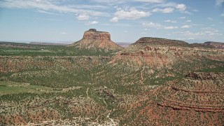 AX136_195E - 5.5K aerial stock footage of flying between Cathedral Butte and a mesa, Manti-La Sal National Forest, Utah