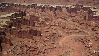 5.5K aerial stock footage of flying away from steep buttes, Monument Canyon, and White Rim, Canyonlands National Park, Utah Aerial Stock Footage | AX136_252E