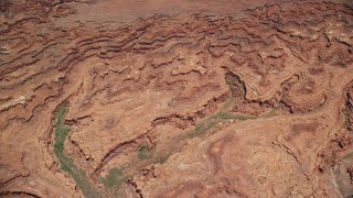 5.5K aerial stock footage tilt from buttes, reveal Colorado River and Meander Canyon, Canyonlands National Park, Utah Aerial Stock Footage | AX136_259E