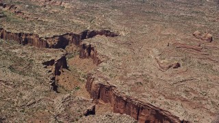 5.5K aerial stock footage of flying by a deep desert canyon, Moab, Utah Aerial Stock Footage | AX136_281