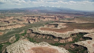 5.5K aerial stock footage of a view of the Salt Wash Canyons at Arches National Park, Utah Aerial Stock Footage | AX137_056E