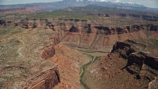 5.5K aerial stock footage of the Colorado River and a canyon road, Arches National Park, Utah Aerial Stock Footage | AX137_076E