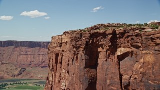 5.5K aerial stock footage of orbiting steep butte cliffs in Moab, Utah Aerial Stock Footage | AX137_148