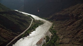 5.5K aerial stock footage of rapids on the Colorado River by State Route 128 in Moab, Utah Aerial Stock Footage | AX138_001