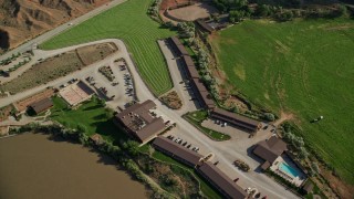 5.5K aerial stock footage of a reverse view of Red Cliffs Lodge hotel in Moab, Utah Aerial Stock Footage | AX138_002E