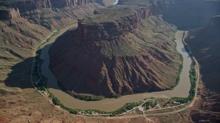 5.5K aerial stock footage of a reverse view of Big Bend Canyon and Colorado River, Arches National Park, Utah Aerial Stock Footage | AX138_015E