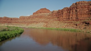 AX138_099E - 5.5K aerial stock footage fly through Meander Canyon, follow Colorado River to shady area, Canyonlands National Park, Utah