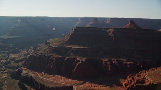 5.5K aerial stock footage of mesas and buttes seen across Shafer Canyon in Canyonlands National Park, Utah Aerial Stock Footage | AX138_116E