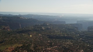 5.5K aerial stock footage of flying by Taylor Canyon in Canyonlands National Park, Utah Aerial Stock Footage | AX138_124