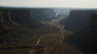 5.5K aerial stock footage wide view of dry riverbed in Taylor Canyon seen from rim of the canyon, Canyonlands National Park, Utah Aerial Stock Footage | AX138_138E