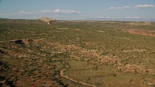 5.5K aerial stock footage of flying over the open desert in Canyonlands National Park, Utah Aerial Stock Footage | AX138_142