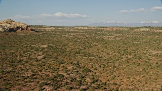 5.5K aerial stock footage fly low over open desert in Canyonlands National Park, Utah Aerial Stock Footage | AX138_144