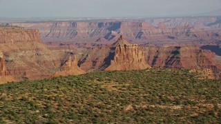 5.5K aerial stock footage of two buttes in Shafer Canyon, Canyonlands National Park, Utah Aerial Stock Footage | AX138_148E