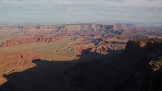 AX138_154 - 5.5K aerial stock footage approach buttes and mesas around Meander Canyon, Canyonlands National Park, Utah