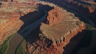 5.5K aerial stock footage of a reverse view of the Goose Neck in Meander Canyon, Canyonlands National Park, Utah Aerial Stock Footage | AX138_160E