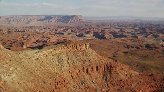 5.5K aerial stock footage orbit a small domed butte in Moab, Utah Aerial Stock Footage | AX138_185E