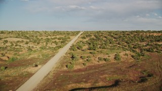 5.5K aerial stock footage of a bend in Hatch Point Road through the desert near Moab, Utah Aerial Stock Footage | AX138_215E