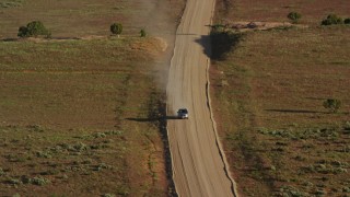 5.5K aerial stock footage track a silver SUV on Hatch Point Road, Moab, Utah Aerial Stock Footage | AX138_223