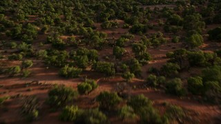 5.5K aerial stock footage approaching South Six-Shooter Peak, North Six-Shooter Peak in a hazy valley, Moab, Utah Aerial Stock Footage | AX138_257E