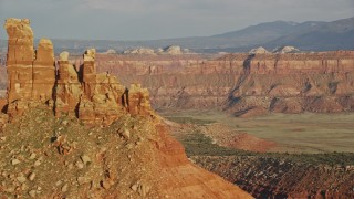 5.5K aerial stock footage of passing North Six-Shooter Peak, revealing South Six-Shooter Peak, Moab, Utah Aerial Stock Footage | AX138_274