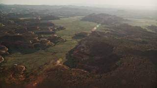 5.5K aerial stock footage video of passing by desert rock formations in Canyonlands National Park, Utah Aerial Stock Footage | AX138_277E