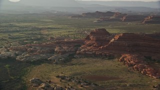 5.5K aerial stock footage orbit desert rock formations in a desert valley, Canyonlands National Park, Utah Aerial Stock Footage | AX138_283E