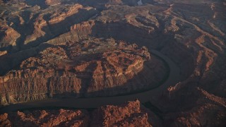 5.5K aerial stock footage of The Loop West, Meander Canyon, and Colorado River at sunset, Canyonlands National Park, Utah Aerial Stock Footage | AX138_317E