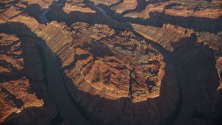 5.5K aerial stock footage of a bird's eye of the river in Meander Canyon at sunset, Canyonlands National Park, Utah Aerial Stock Footage | AX138_321E