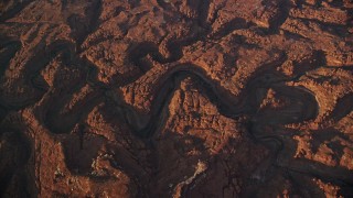 5.5K aerial stock footage bird's eye view of dry riverbeds through rocky canyons, Canyonlands National Park, Utah, sunset Aerial Stock Footage | AX138_336E