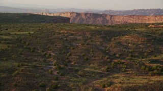 5.5K aerial stock footage of panning across canyon, seen from Hatch Point, Moab, Utah, sunset Aerial Stock Footage | AX138_359E